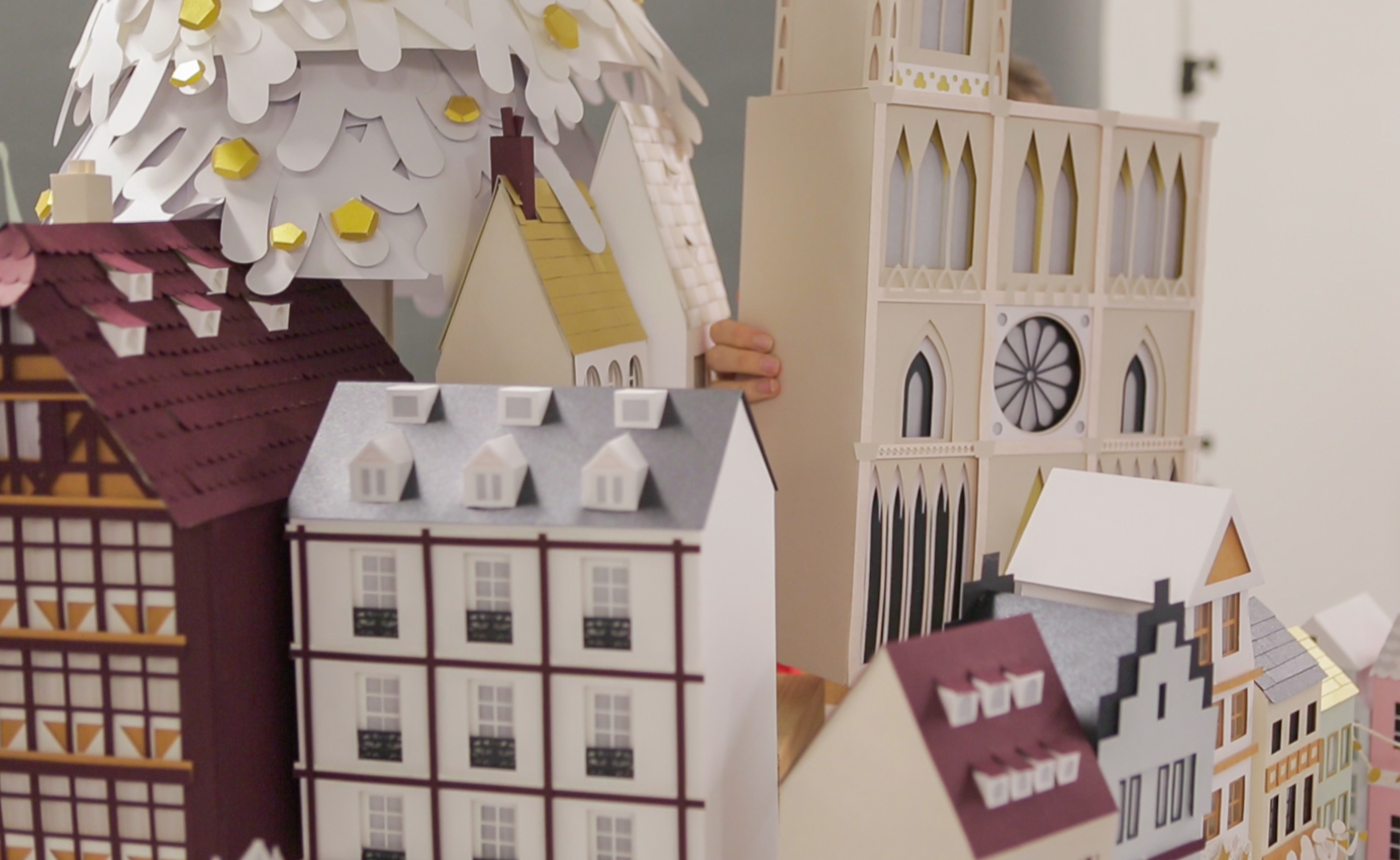 assembling paper buildings at photography studio
