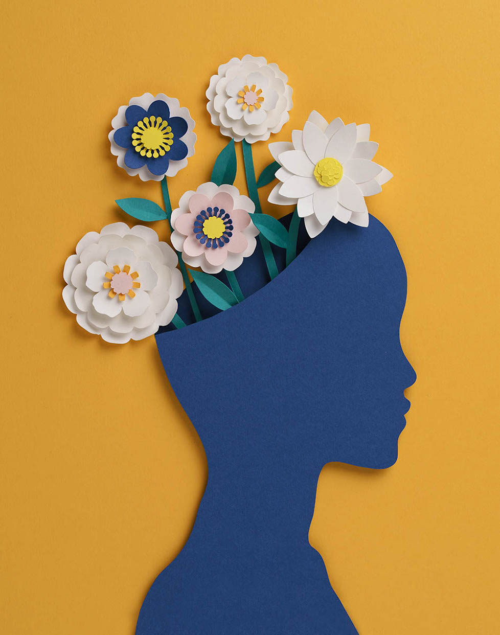 Paper-cut floral head with flowers growing out of the top of the head